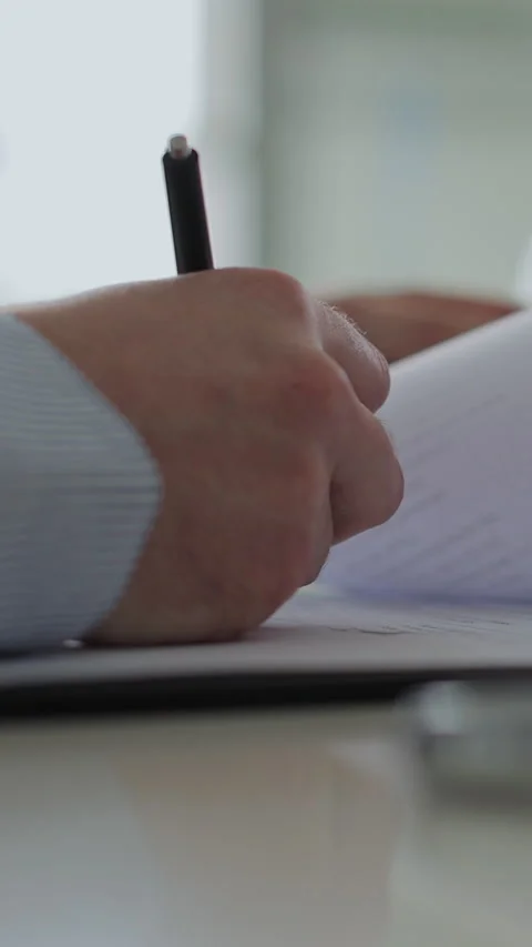 Vertical video Close up of man buying a car and signing the contract Stock Footage 337239430