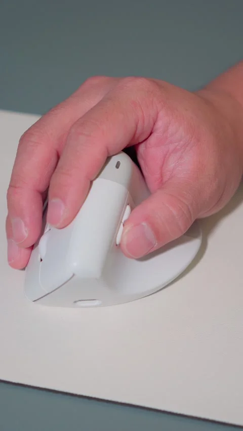 Vertical Video Close Up Man Hand Using White Vertical Ergonomic Mouse Stock Footage 341920214