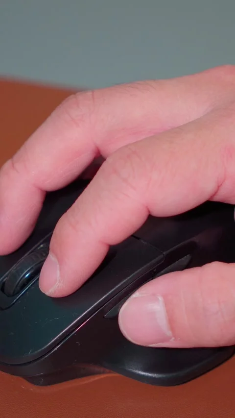 Vertical Video Close Up Man Hand Using Computer Mouse at Office Desk Stock Footage 341920229