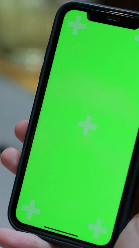 Vertical video. Close up of man hands using green screen smartphone Video stock 345239994