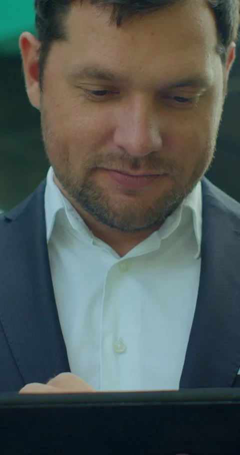 Vertical video. Close up of Man Holding Modern digital tablet. Stock Footage 345587848