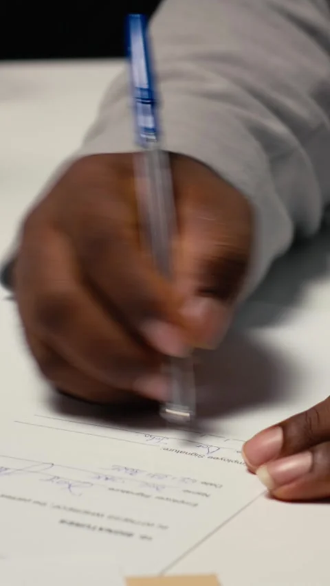 Vertical Video Close up of a man signing work contract with human resources Stock Footage 318045468