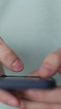 Vertical video Close up man using social media application on smartphone text 写真素材