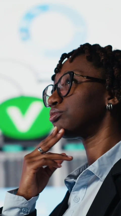 Vertical video Close up of management executive comparing company metrics on Stock Footage 318684476