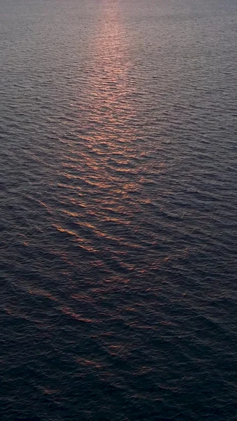 Vertical Video Close Ocean Surface with Sunset Light Texture Stock Footage 341852411
