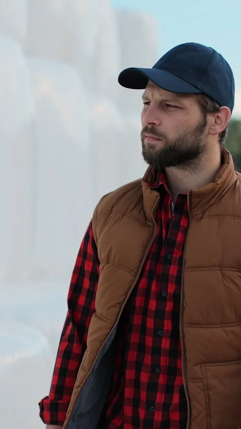 Vertical video. Close up of professional agronomist walking hay stack on season Stock Footage 344630496