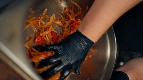Vertical video close-up in a professional kitchen in chef in a black jacket Stock Footage 276284649