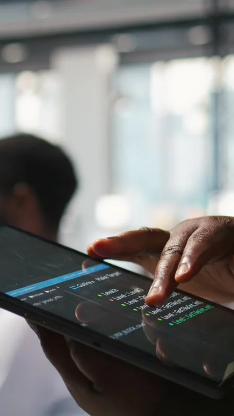Vertical video Close up of programmer utilizing AI on tablet to optimize Stock-Footage 312708205
