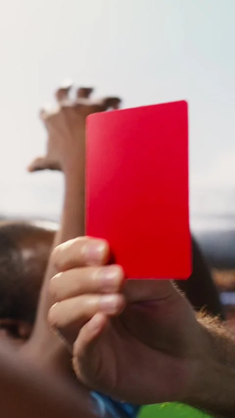 Vertical Video Close up of red card shown by referee as foul punishment during Stock Footage 338046902