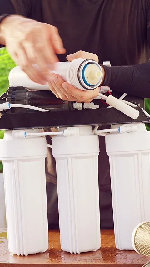 Vertical video. Close Up Removal of Old Reverse Osmosis Membrane Filter From Wat Stock Footage 335214702