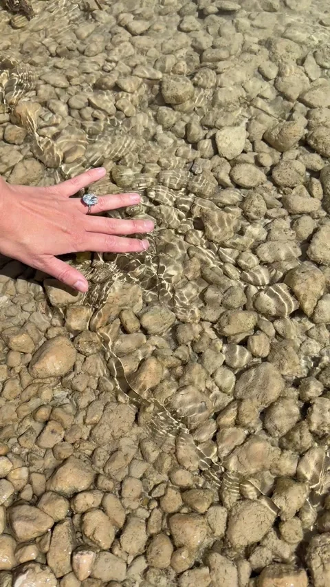 Vertical video close ring hand on pale stones texture in daylight Stock Footage 319402712