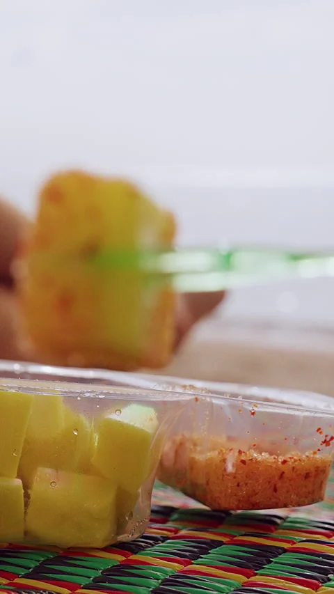 Vertical video. Close Up of Salted Mango... | Stock Video | Pond5