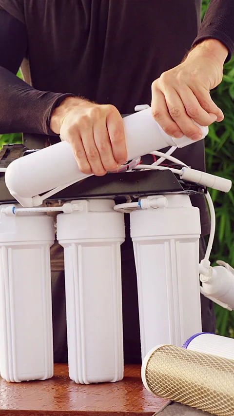 Vertical video. Close Up Sealing Reverse Osmosis Membrane Housing After New Filt Stock Footage 335214839