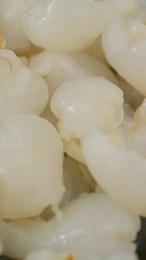 Vertical Video: Close-up shot of peeled and pitted lychee 스톡 동영상 340542419