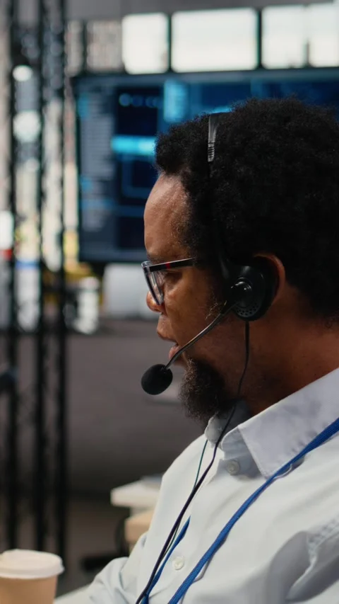 Vertical video Close up of startup software developer doing tech support Stock Footage 323404290