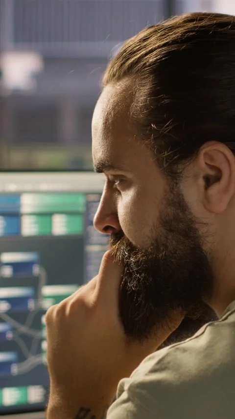 Vertical video Close up of system administrator transforming data into Stock Footage 319489547