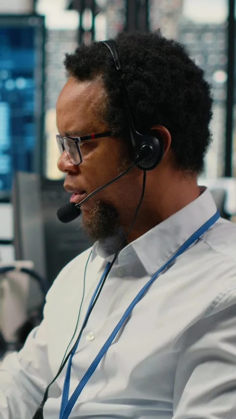 Vertical video Close up of system administrator in office providing remote Stock Footage 323142066