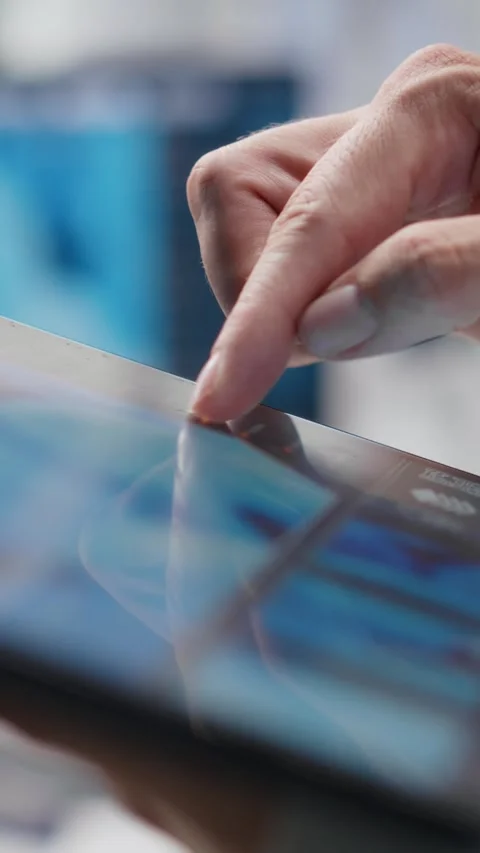 Vertical Video Close up of tablet with modern laboratory software used by Stock Footage 317730703