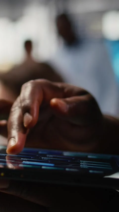 Vertical video Close up of tablet used by admin in office doing software Stock Footage 323142220