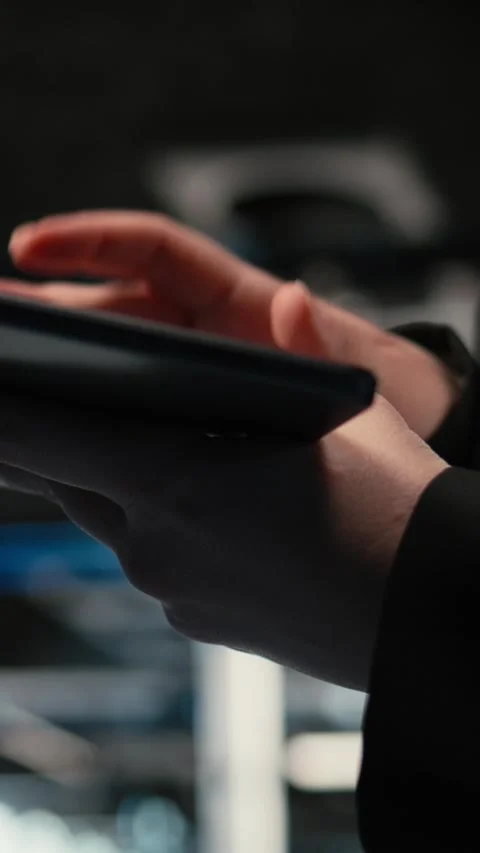 Vertical video Close up of tablet used by data center admin troubleshooting Stock Footage 329321485