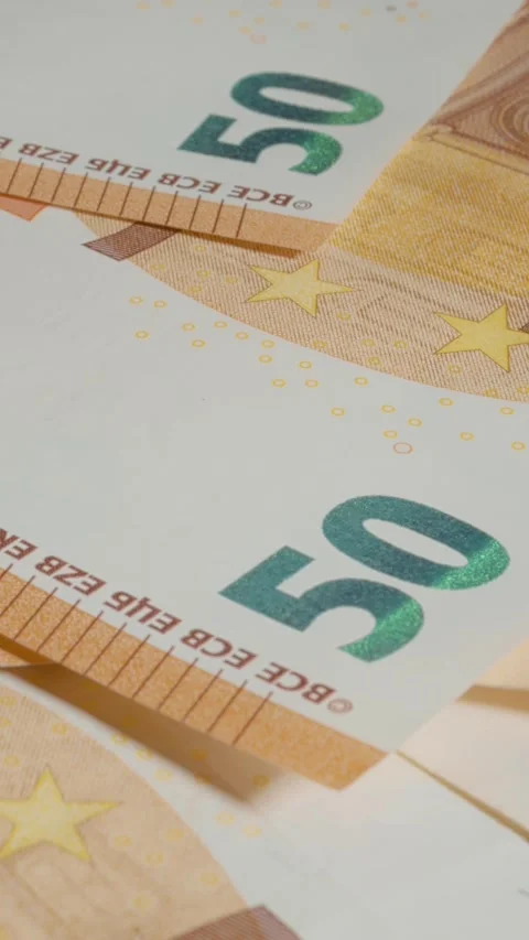Vertical video Close up view of 50 euro banknote showcasing intricate details Stock Footage 327596326