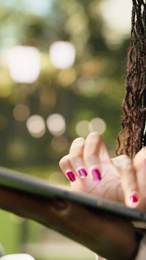 Vertical Video Close-up view of courier tapping digital tablet outdoors with Stock Footage 344379611