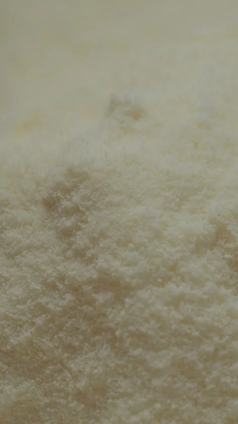 Vertical video Close-up view of fine powdered milk for baking and cooking Stock Footage 329618740