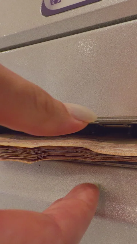 Vertical video. Close Up View Of Human Hand Inserting Stack Of Thai Baht Banknot Stock Footage 327412254