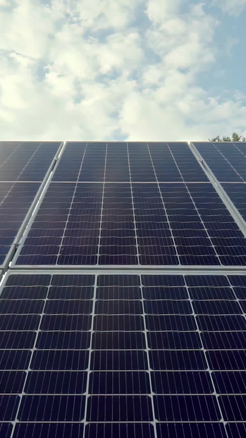 Vertical video with close-up view of solar panels arranged in a grid pattern Stock Footage 309770918