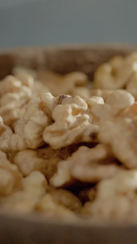 Vertical video Close-up view of walnut kernels showcasing their natural texture Stock Footage 329617609