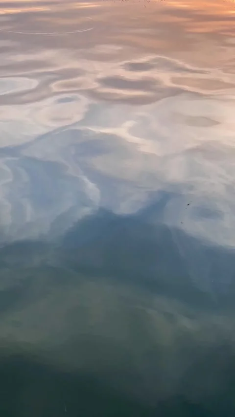 Vertical video: close up view of the waves with sun reflections at sunset, .. Stock Footage 246490301