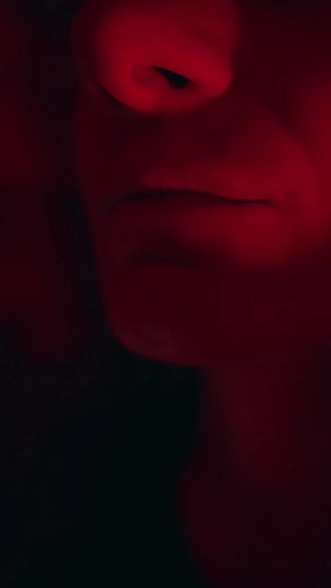 Vertical video. Close Up View of Young Woman Wearing Artificial Vampire Fangs Un Stock-Footage 339194019