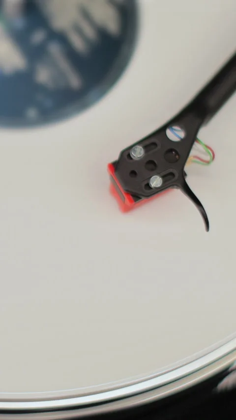 Vertical video Close-up of a vinyl record spinning Stock Footage 338084346