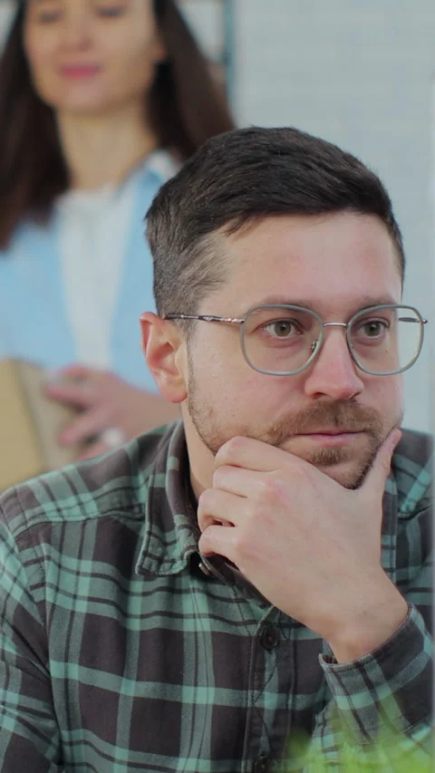 Vertical video. Close-up of a warehouse manager and an employee using a computer Stock Footage 345728593