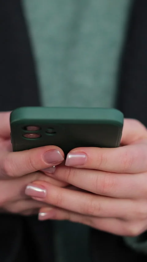Vertical video Close up woman using social media application on smartphone Stock Footage 339577590