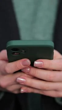 Vertical video Close up woman using social media application on smartphone te 写真素材