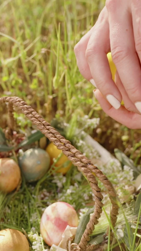 Vertical video. A Close-Up of a Woman's Hands Holding Several Colorful Easter Stock Footage 296034067