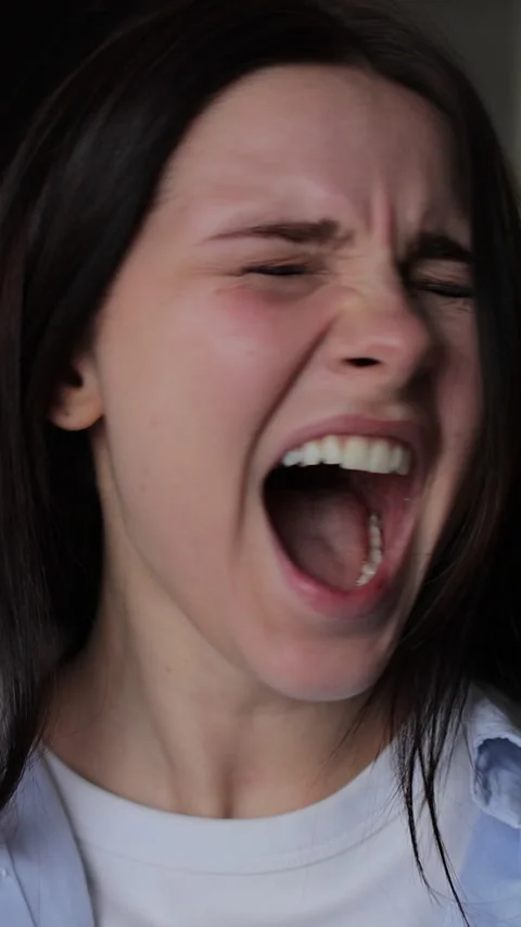 Vertical video Close up of a young stressed woman shouting Stock-Footage 337650715