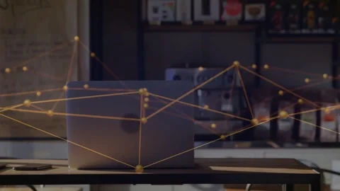 Vertical video: Closed laptop, nodes starting from corners and sweeping in Stock Footage 332275899