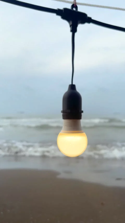 Vertical video, Closeup of lights on the beach Stock Footage 234102897