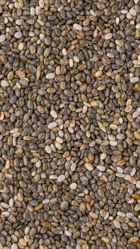 Vertical video. Closeup, top view of chia seeds. Food backdrop Vidéo 248062170