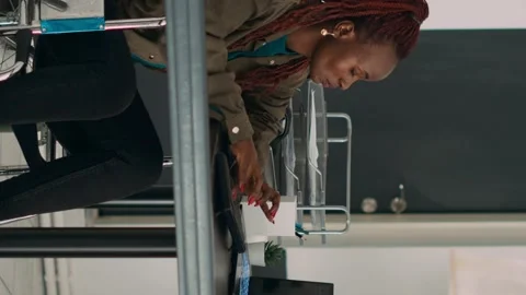 Vertical video: Cloud programmer in wheelchair using server data to create Stock Footage 219701974