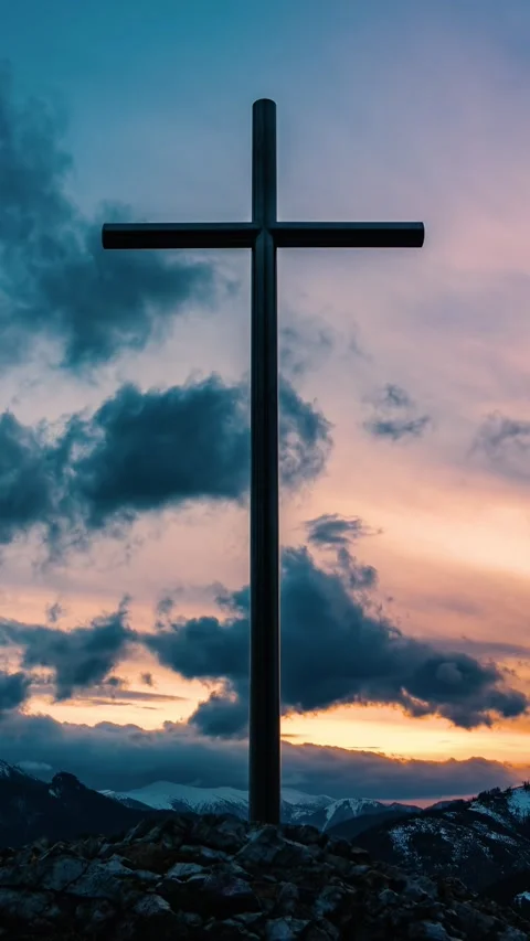 Vertical video of Clouds moving fast over religious cross in peaceful evening Stock Footage 264957152