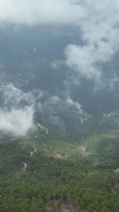 Vertical Video Cloudy landscape in the mountains aerial view Stock Footage 222487347