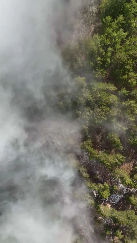 Vertical Video Cloudy landscape in the mountains aerial view Stock Footage 222492783