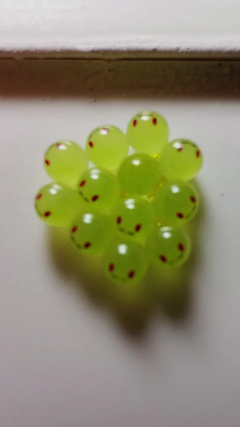 Vertical video. Cluster of Bright Green Amphibian Eggs Attached to Smooth Wall i Stock Footage 324552287