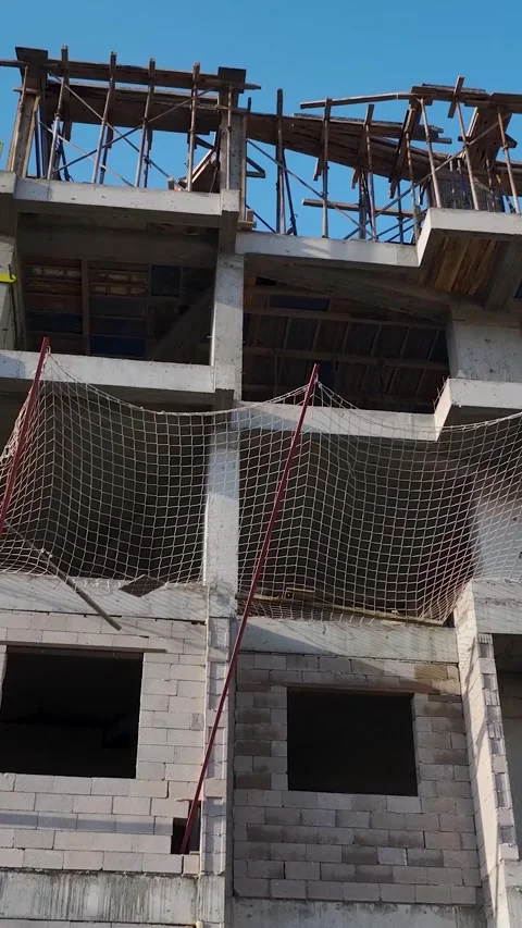 Vertical Video Coastal Construction Site with Sea and City Background Stock Footage 342120330