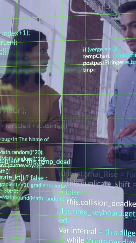 Vertical video: Code and green grid overlay appearing, pair reviewing laptop and Stock Footage 329841341