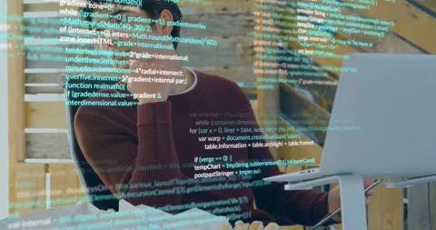 Vertical video: Code appearing, man in sweater studying laptop on stand, Stock Footage 333965822
