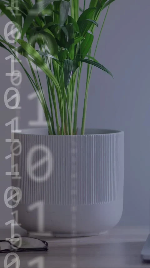 Vertical video: Code appearing over plant, scrolling into nodes while laptop Stock Footage 334771158